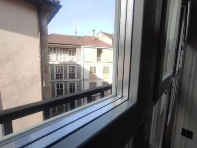 a window with a view of a building at 3. Amplio y muy luminoso para disfrutar de Ourense in Ourense