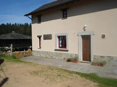 a white house with a door and a window at Casa de Aldea Carboneiro in Naraval