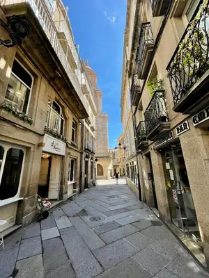 an empty street in a city with buildings at Piso Principal in Ourense