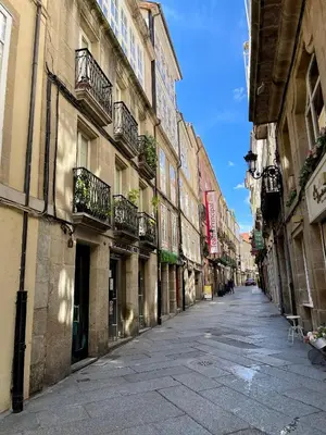 an empty street in a city with buildings at Piso Principal in Ourense