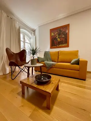 a living room with a couch and a coffee table at Piso Principal in Ourense