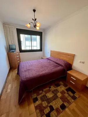 a bedroom with a large bed and a window at Playa grande Miño travesía in Miño