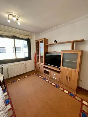 a living room with a large flat screen tv at Playa grande Miño travesía in Miño