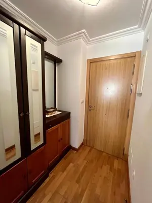 a room with a wooden door and a wooden floor at Playa grande Miño travesía in Miño