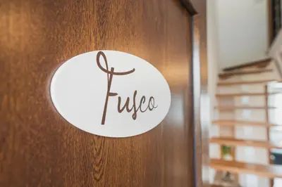 a door with the word rules written on it at Apartamentos Luis in Arzúa