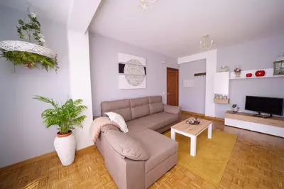 a living room with a couch and a table at Antoxos Sacra Home II in Chantada