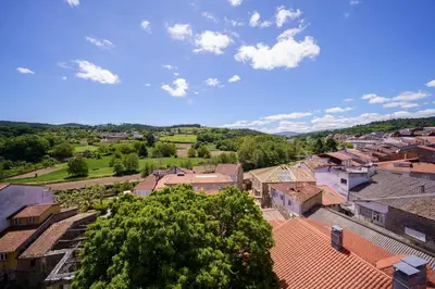 an overhead view of a town with buildings and trees at Antoxos Sacra Home II in Chantada