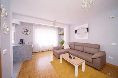 a living room with a couch and a table at Antoxos Sacra Home II in Chantada