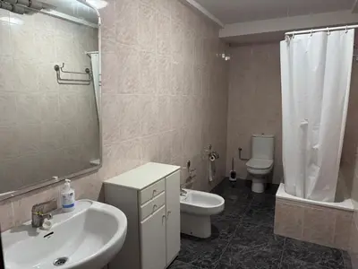 a bedroom with a large white bed and two night stands at Razal in Miño