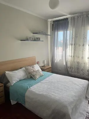 a bedroom with a bed and a window at Piso pineda in Monforte de Lemos