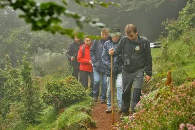 a group of people walking down a trail at Casa La Parra in Villar de Vildas