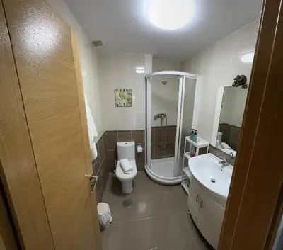 a bathroom with a shower and a toilet and a sink at Carlos III Foz in Foz