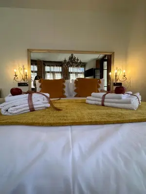 a large bed with two pillows on top of it at CLAREN´S BOUTIQUE ROOMS in Cangas del Narcea