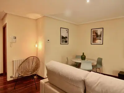 a living room with a couch and a table at 1F.Céntrico y tranquilo en la ciudad de las Burgas in Ourense