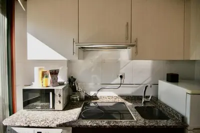 a kitchen with a sink and a counter top at 1F.Céntrico y tranquilo en la ciudad de las Burgas in Ourense