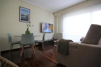 a living room with a couch and a table at 2F. El mejor lugar para descansar y vivir Ourense in Ourense