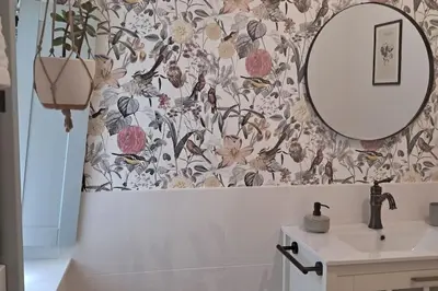 a bathroom with a sink and a mirror at A Maraxe in Rinlo