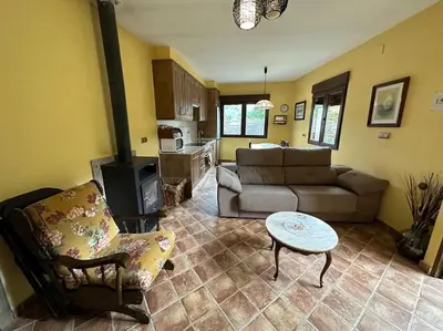 a living room with a couch and a table at casa carmiña in Ourense