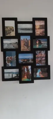 a group of pictures hanging on a wall at Apartamento Laguna in Ribadeo
