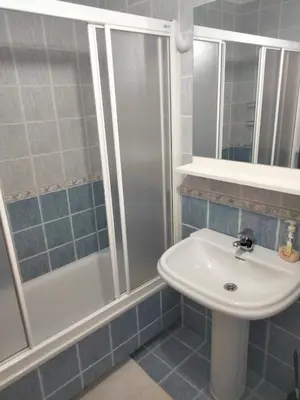a bathroom with a shower and a sink at Apartamento Laguna in Ribadeo