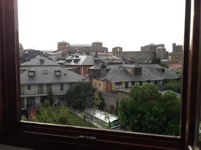 a view of a city from a window at TEMPLE in Ponferrada