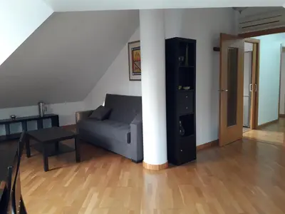 a living room with a couch and a table at TEMPLE in Ponferrada