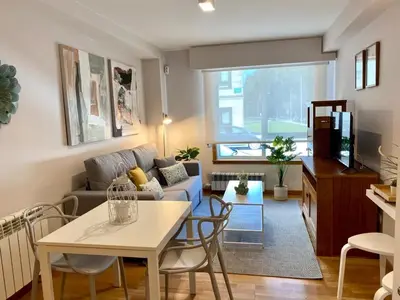 a living room with a couch and a table at Andainas A in Milladoiro