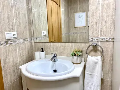 a bathroom with a sink and a mirror at Andainas A in Milladoiro