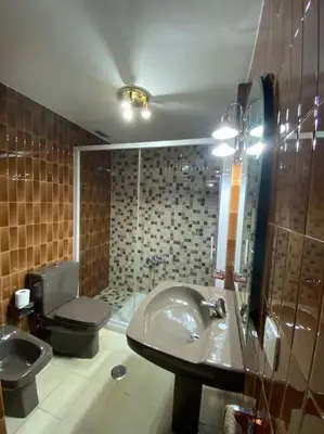 a bathroom with a sink and a toilet at Piso Doniz in Ourense