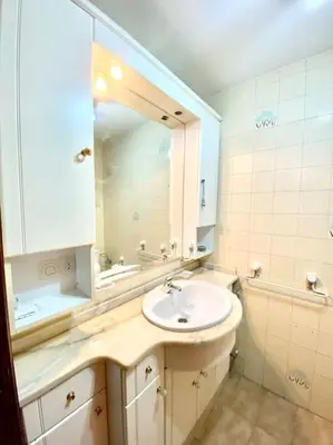 a bathroom with a sink and a mirror at Piso Doniz in Ourense