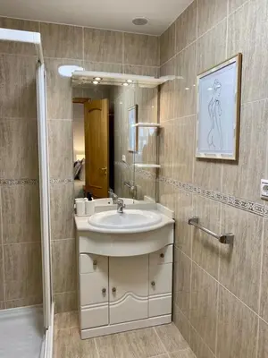 a bathroom with a sink and a mirror at Andainas G in Milladoiro