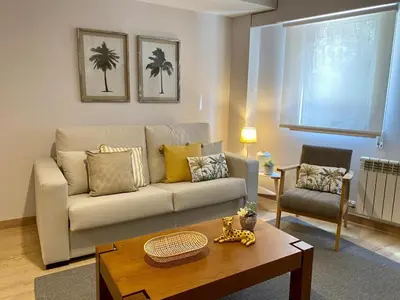 a living room with a couch and a coffee table at Andainas B in Milladoiro