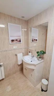 a bathroom with a sink and a toilet at Andainas B in Milladoiro