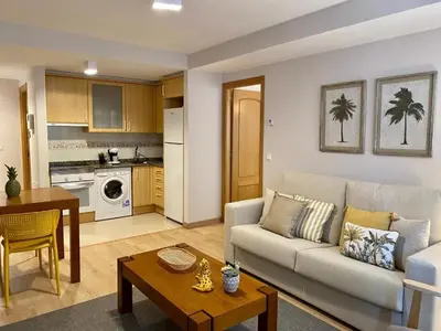 a living room with a couch and a table at Andainas B in Milladoiro