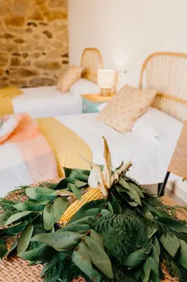 a table with a bouquet of corn on it at Casa do Cuco - Rural house in Friol