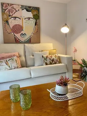 a living room with a couch and a coffee table at Andainas F in Milladoiro