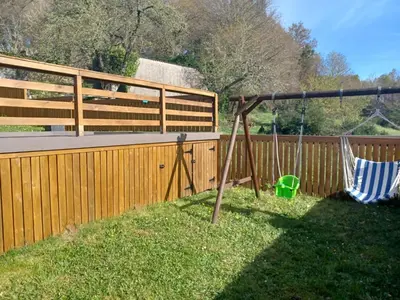 a yard with two swings and a fence at Casanova1914 in Villatuge