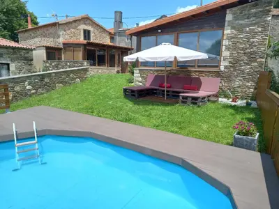 a backyard with a swimming pool and a house at Casanova1914 in Villatuge