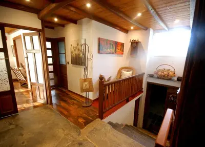 a hallway of a house with a staircase and a room at Agradable casa de aldea en un entorno natural in Layosa