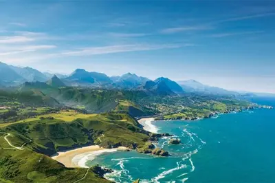 an aerial view of a beach and the ocean at zentralclub La Osera visionando la naturaleza in Santiago del Hermo