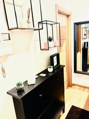a black dresser in a room with a window at Lula Apartamento in Betanzos