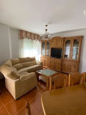 a living room with a couch and a table at O Lar de Jose in Monforte de Lemos