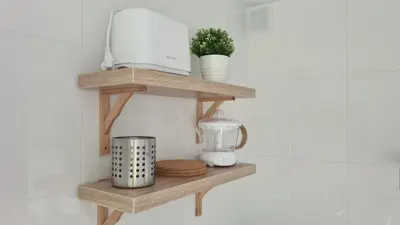 a shelf in a kitchen with a blender on it at VUT Sierra Pambley in Villablino