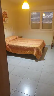 a bedroom with a bed in a room at Grecia in Barreiros