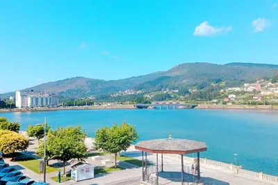 a view of a large lake with a gazebo at Los Leones in Viveiro