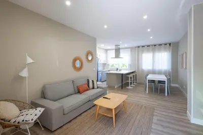 a living room with a couch and a table at Miño Suites I in Miño