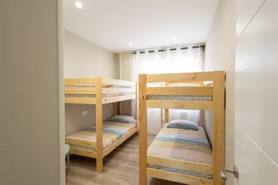 a room with two bunk beds in a room at Miño Suites I in Miño