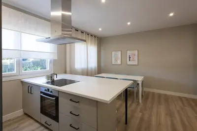 a kitchen with a sink and a counter top at Miño Suites I in Miño