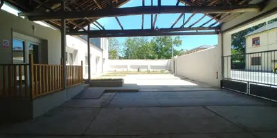 an empty hallway of a building with an open door at Apartamentos Turísticos Magencio in Carucedo