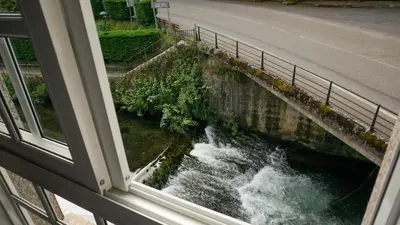 a view of a river from a window at Pensión Castro Parrillada in Samos